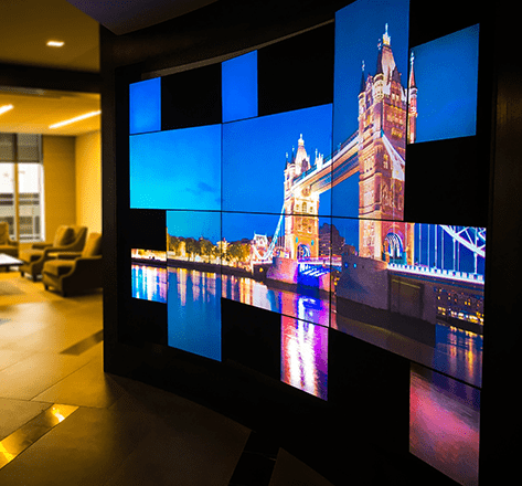 A mosaic video wall of the Tower Bridge in London, England in a professional business lobby